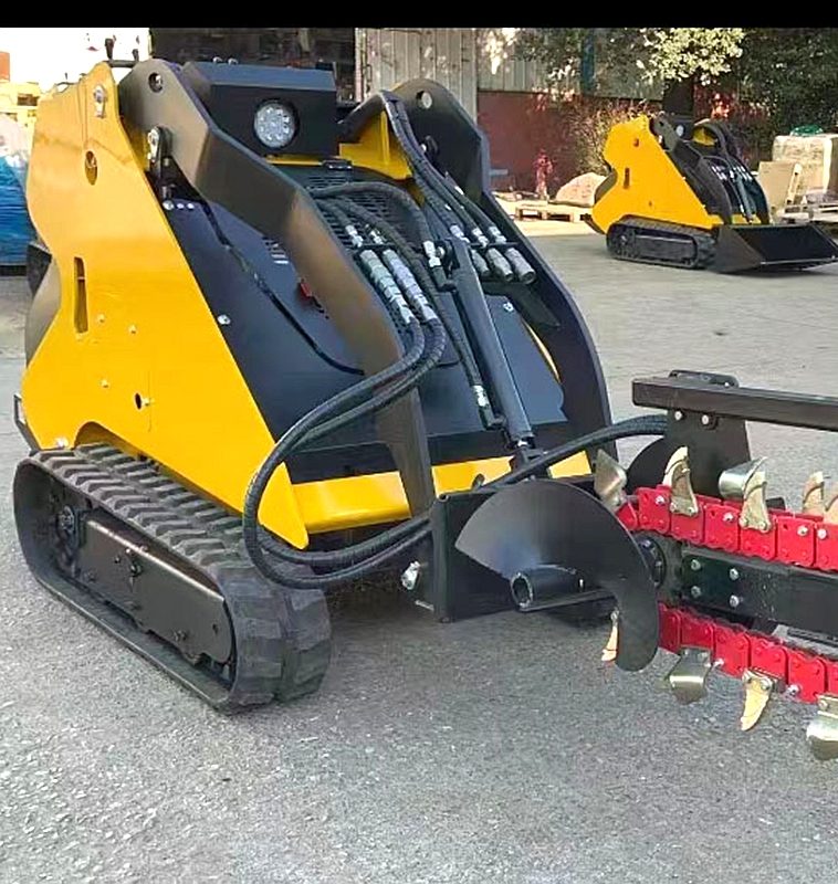 Mini tracked skid steer loader with trencher attachment